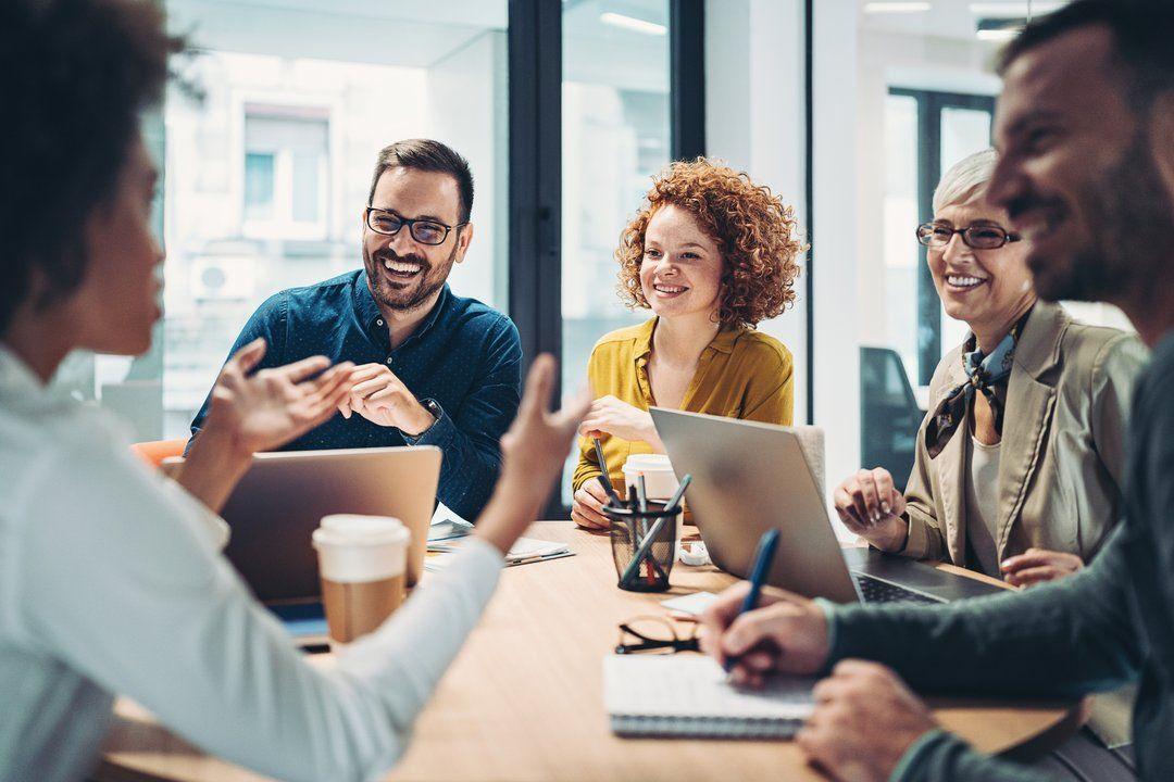 A compliance team holding a meeting to discuss the NIST AI Risk Management Framework